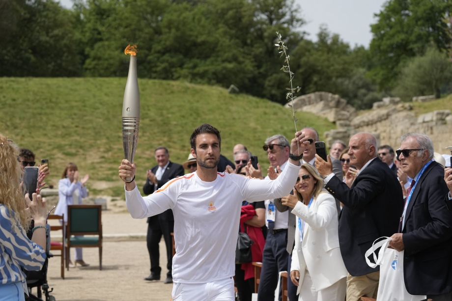 Olympic flame begins journey to Paris