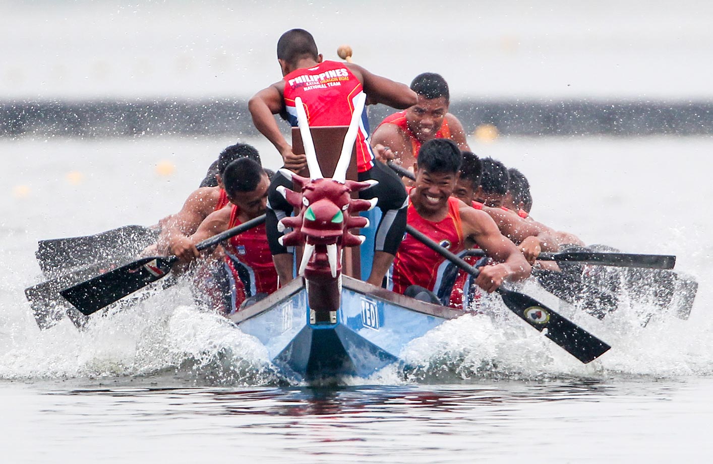 Dragon boat racing practice on a warm spring morning at Lake